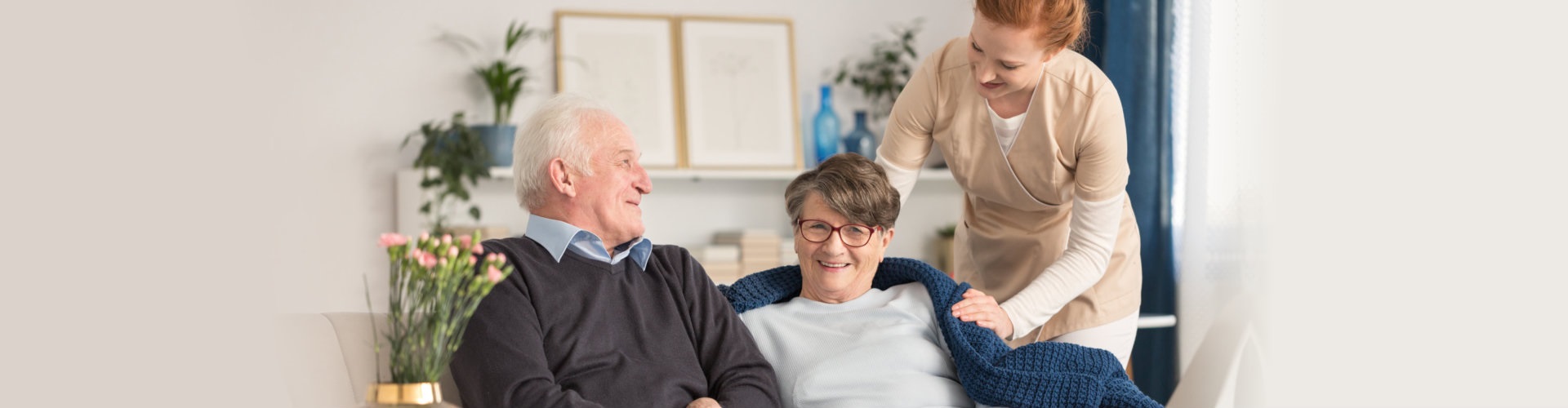 senior couple with caretaker